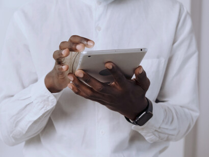 A man uses his tablet for working and communication