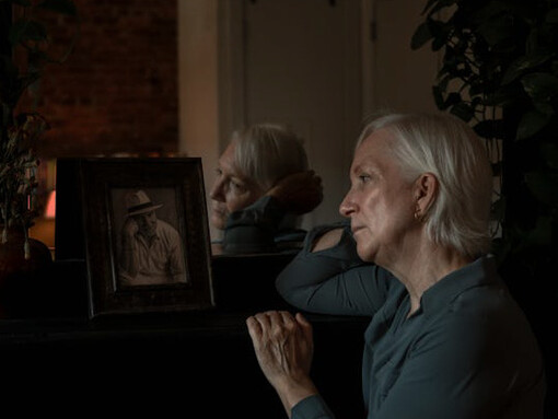 Through tear-filled eyes, she whispers silent prayers and shares unspoken conversations with him, knowing he watches over her from beyond