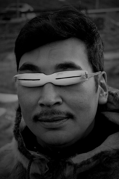 Inuit snow goggles made of caribou antler with a caribou sinew strap