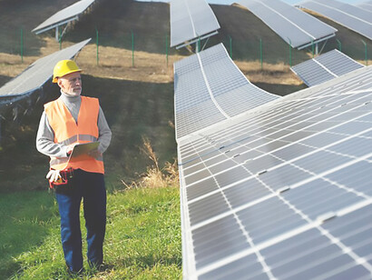 People near alternative energy plants, highlighting solar panels and the focus on energy efficiency, renewable energy, and the fight against climate change