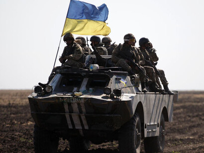 Ukrainian conflict showing military tanks, armed soldiers, and deployed troops