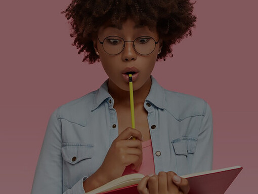 Shocked female student has stupefied gaze in notebook, carries pencil