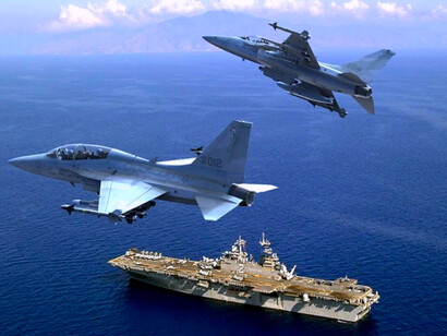 During a US-Philippines joint exercise, the Philippine Air Force fighter jets flow over a US amphibious assault ship