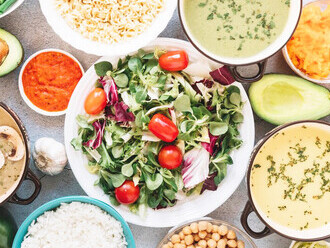 A salad featuring a variety of fruits and vegetables, showcasing healthy plant-based ingredients and vegan nutrition