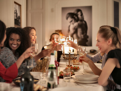 Friends make a toast at a dinner party