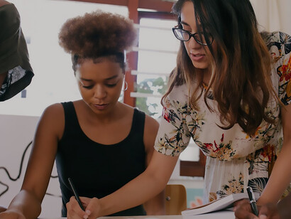 A collective of women in a community, savoring a shared moment of connection and camaraderie