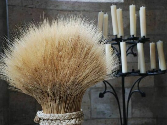 A sheaf of wheat, from Christmastide at The Cloisters, stands near the altar in Langon Chapel. The ancient identification of wheat with life and renewal was incorporated into Christian liturgy and the iconography of the Nativity. Courtesy of The Metropolitan Museum of Art.