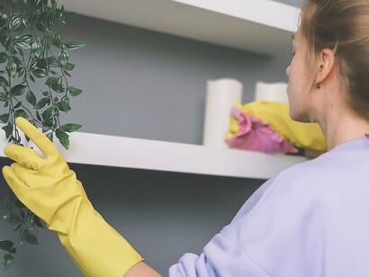 Capturing a poignant moment, the photograph of a woman performing household chores underscores the prevailing inequality, shedding light on the disproportionate time women invest in domestic responsibilities compared to their male counterparts