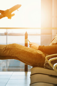 Man waiting for boarding in the airport terminal