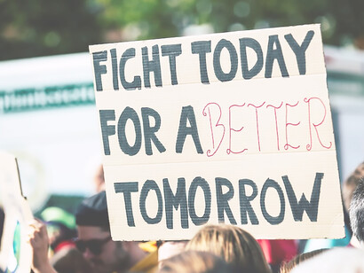 In Lorenzer Platz, Nuremberg, Germany, a person raises a sign that reads, "fight for a better tomorrow" during the global climate change strike on September 20, 2019, emphasizing the message "No Planet B" as part of the Global Climate Strike