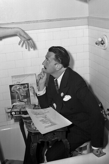 Artist Salvador Dali seated in a bathtub at the Ambassador Hotel in Los Angeles, USA
