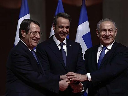 Prime Minister Benjamin Netanyahu, his Greek counterpart Kyriakos Mitsotakis and Cypriot President Nikos Anastasiadis shake hands in Athens on January 2, 2020, ahead of the signing of an agreement for the EastMed pipeline project designed to ship gas from the eastern Mediterranean to Europe