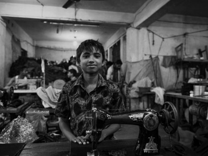 As the global fashion industry continues to prioritise cheap labor and quick production, workers like this young boy face harsh realities of a system that demands more and gives less