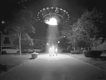 A recreation of three people looking up at a UFO