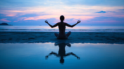 Meditating at sunset