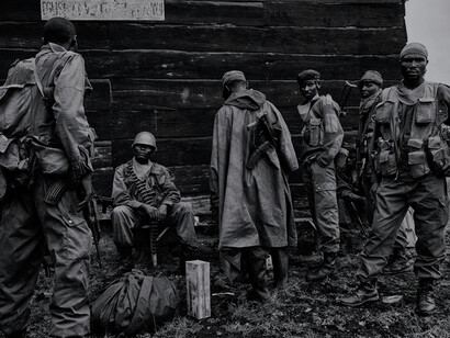 Soldiers rest on the frontline in Kibati, Democratic Republic of Congo, during the conflict between the Democratic's army and the Tutsi militia under General Laurent Nkunda in 2008