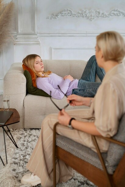 A young girl engaging in a conversation with her therapist, showcasing the importance of mental health support for children