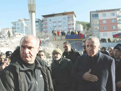 Turkish President Recep Tayyip Erdogan inspects damage in the aftermath of a deadly earthquake in Kahramanmaras, Turkey