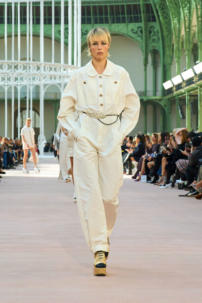 Set against the breathtaking backdrop of the Grand Palais in Paris, France, the Spring-Summer Ready-To-Wear Show highlights Chanel's signature blend of classic sophistication and modern whimsy, as each look captivates with its intricate details and playful contrasts