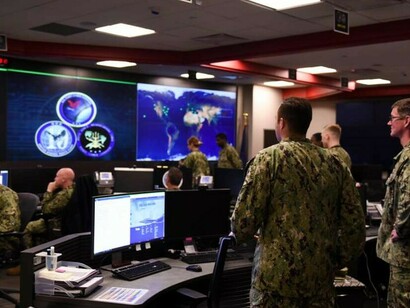 At Fort George G. Meade, Maryland, sailors monitor operations inside the Fleet Operations Center at the headquarters of U.S. Fleet Cyber Command/U.S. 10th Fleet, a key hub for global cyber activity