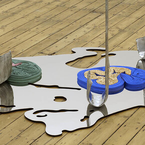 Alice Channer, Deepwater Horizon, 2014, Mirror polished and laser cut stainless steel, Super-Matt laquered and laser cut stainless steel, Cast and mirror polished aluminium, Accordion pleated snake skin heat-embossed stretch polyester, Stretch alligator print maxi-skirt, Pelletised HDPE, Stretch snake print vest top, 150 x 437.5 x 114 cm (59 x 172 3/16 x 44 7/8 inches), FXP Photography, London, Courtesy of The Approach, London
