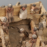 Egyptian (found in Mastaba B, South Pyramid, Al Lisht)
Model of Estate Workshops: Granary, Bakery, and Weaver's Shop
Middle Kingdom, 12th Dynasty, 1991–1782 BC
Wood, paint
L. 19.5 in. (49.5 cm), W. 19 1/16 in. (48.5 cm), H. of walls, 3 ½–4 3/8 in. (9–11 cm)
Sidney and Lois Eskenazi Museum of Art, William Lowe Bryan Memorial