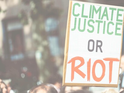 Man holding a sign to protest climate change