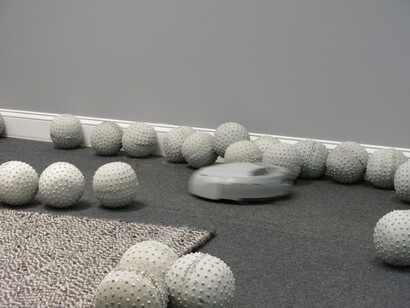 Nadim Abbas, Zone I, 2014.
Lightweight concrete casts, robotic vacuum cleaner, rug, skirting board, house paint. Dimensions variable.