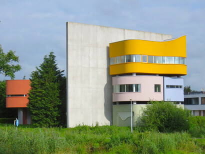 Detail of the sharp, angular roofline of Wall House II in Groningen, creating a dramatic silhouette against the local sky