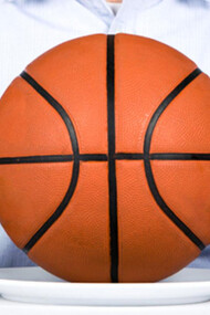 A man with a knife and fork, and a basketball