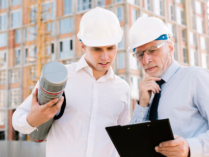Workers in helmets at a construction site implementing AI for urban development, sustainable architecture, and smart building technologies