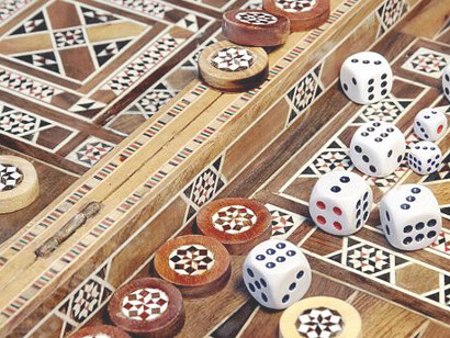Backgammon set embellished with elaborate Khatam Kari designs, accompanied by a pair of dice