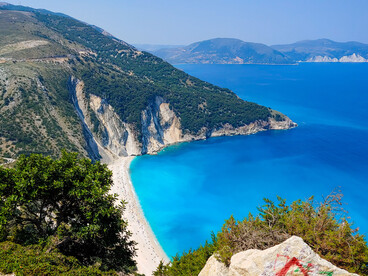 The stunning turquoise waters and dramatic cliffs of Lefkada, Greece, showcase the breathtaking beauty of the Ionian coastline