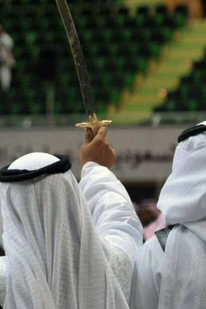 Men raise swords in Saudi Arabia