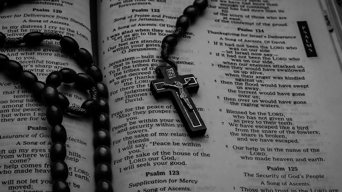 A Komboskini resting on a Bible, symbolizing faith and unceasing prayer