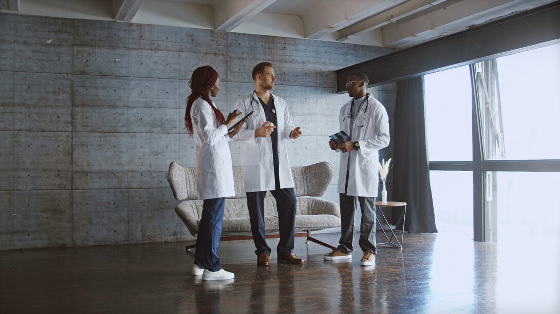 The weight of responsibility hangs in the air as these three doctors connect over shared struggles, each one striving to make a difference despite their own vulnerabilities