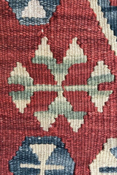 Monster motif, detail. It represents the family's wish to be kept away from the evil eye and for the monsters to protect themselves. From a carpet depicting a young woman's expectations and desires for life as she prepares to marry. Made for an unmarried young woman's dowry. Middle Anatolia, Kayseri, Turkey. 20th century. Private collection