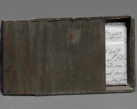 Freedom papers and handmade tin carrying box belonging to Joseph Trammell, 1852. Gift of Elaine E. Thompson