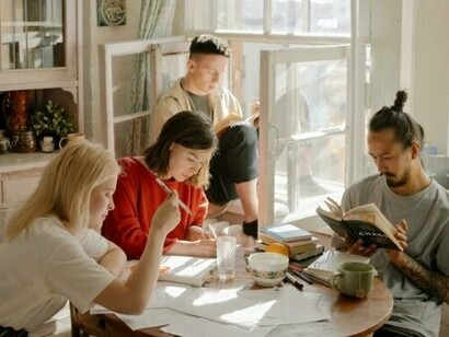 A bunch of students studying, showing real human effort behind academic success