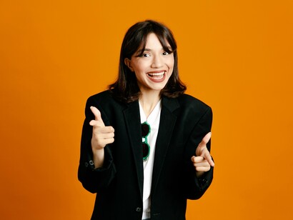 A smiling professional projecting nonstop enthusiasm, reflecting the expectation to maintain positivity even under pressure