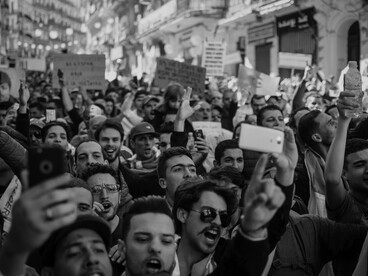 Black-and-white photo of a protest crowd in Algeria