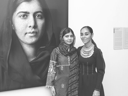 Fighting for change: Malala Yousafzai stands with her portrait by Iranian-born artist Shirin NeshatFighting for change: Malala Yousafzai stands with her portrait by Iranian-born artist Shirin Neshat