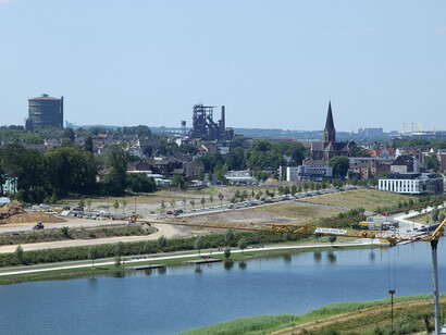 The breathtaking view from Kaiserberg offers a stunning panorama of Phoenix Lake and the vibrant district of Hörde in Dortmund, Germany