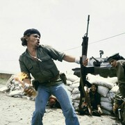 Susan Meiselas, Sandinistas at the walls of the Estelí National Guard headquarters: 'Molotov Man', Estelí, Nicaragua, July 16th, 1979, 1979, Chromogenic print, 16 x 20 inches (40.6 x 50.8 cm)