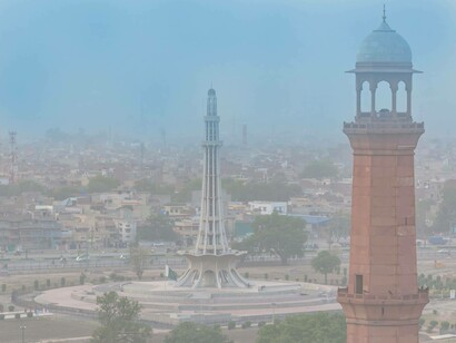 The Alamgir Tower in the background is a high-rise building in Lahore, Pakistan