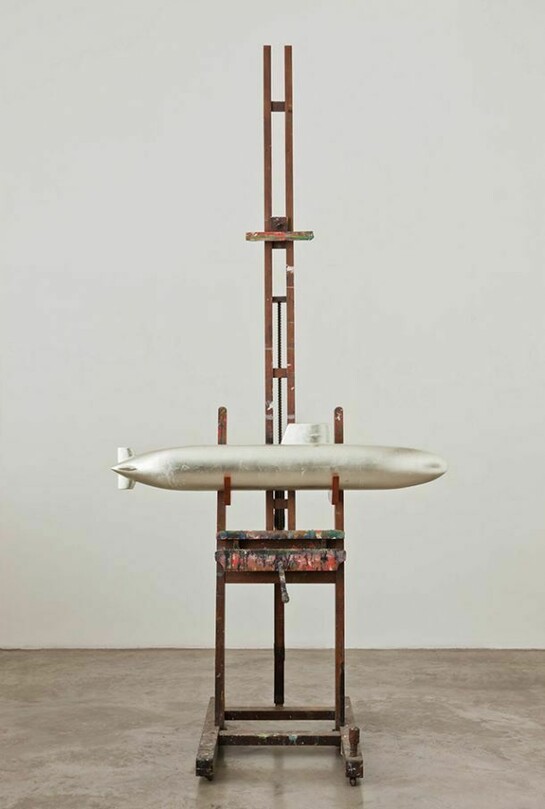 Dorothy Cross, Shark Heart Submarine, 2011, 19th century oak painters easel, model submarine, laminated wood, oil-gilded in white gold shark’s heart in glass jar with alcohol, Dimensions variable, Courtesy of the Artist and Kerlin Gallery, Dublin