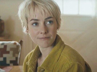 Jena Malone stares with care in a scene from Adopting Audrey (2022) which was released in August