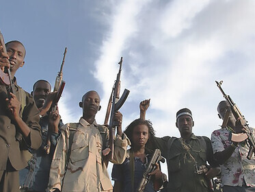 Interim Juba Administration soldiers celebrate rescuing 30 hostages abducted by Al-Shabaab in Kismayu, aided by AMISOM Kenya Defence Forces air surveillance