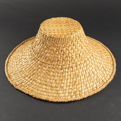  Lisa Telford, Woven Cedar Bark Hat, woven red and yellow cedar bark, 5.5x14.25x14.25 inches. Courtesy of Stonington Gallery