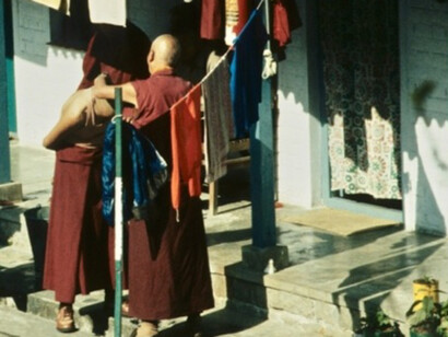Monks shaving heads in the courtyard of the residence of Dalai Lama in McLeod Ganj, Dharamshala, December 1991. Photo: J. MacLeod